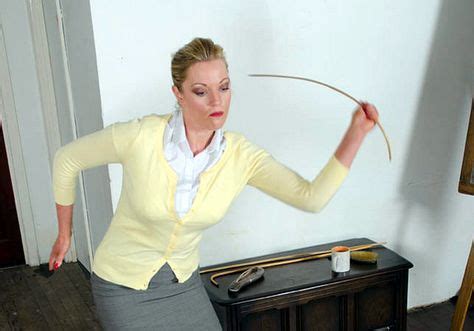 Madam Kenworthy caning Parker. . Spanking video clip